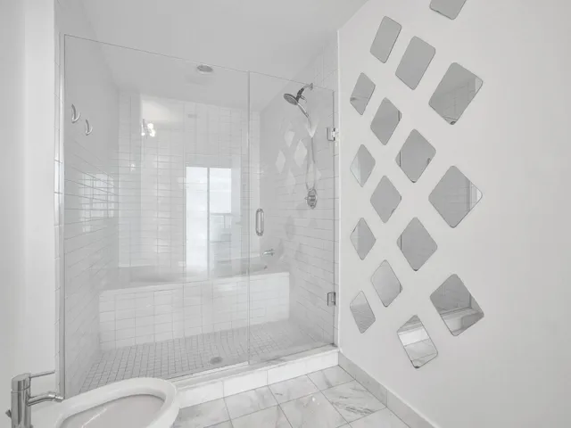 a room with gym equipment and cabinets