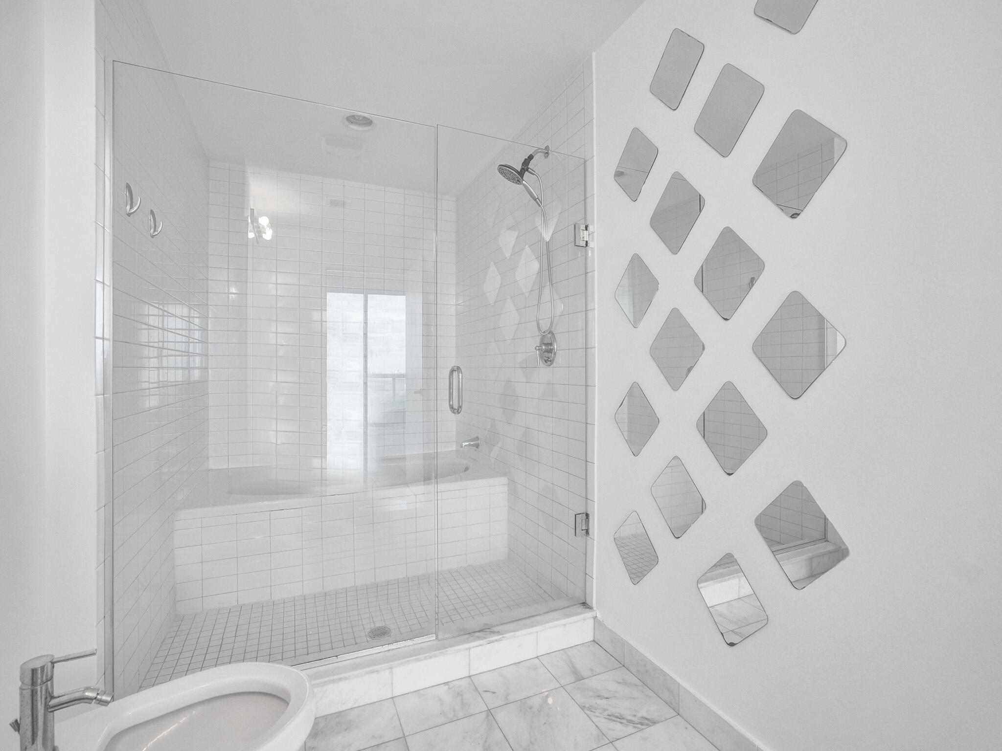 888 Biscayne Boulevard, Unit 811 Miami, FL 33132 - Photo 20 of 48 a bathroom with a shower curtain