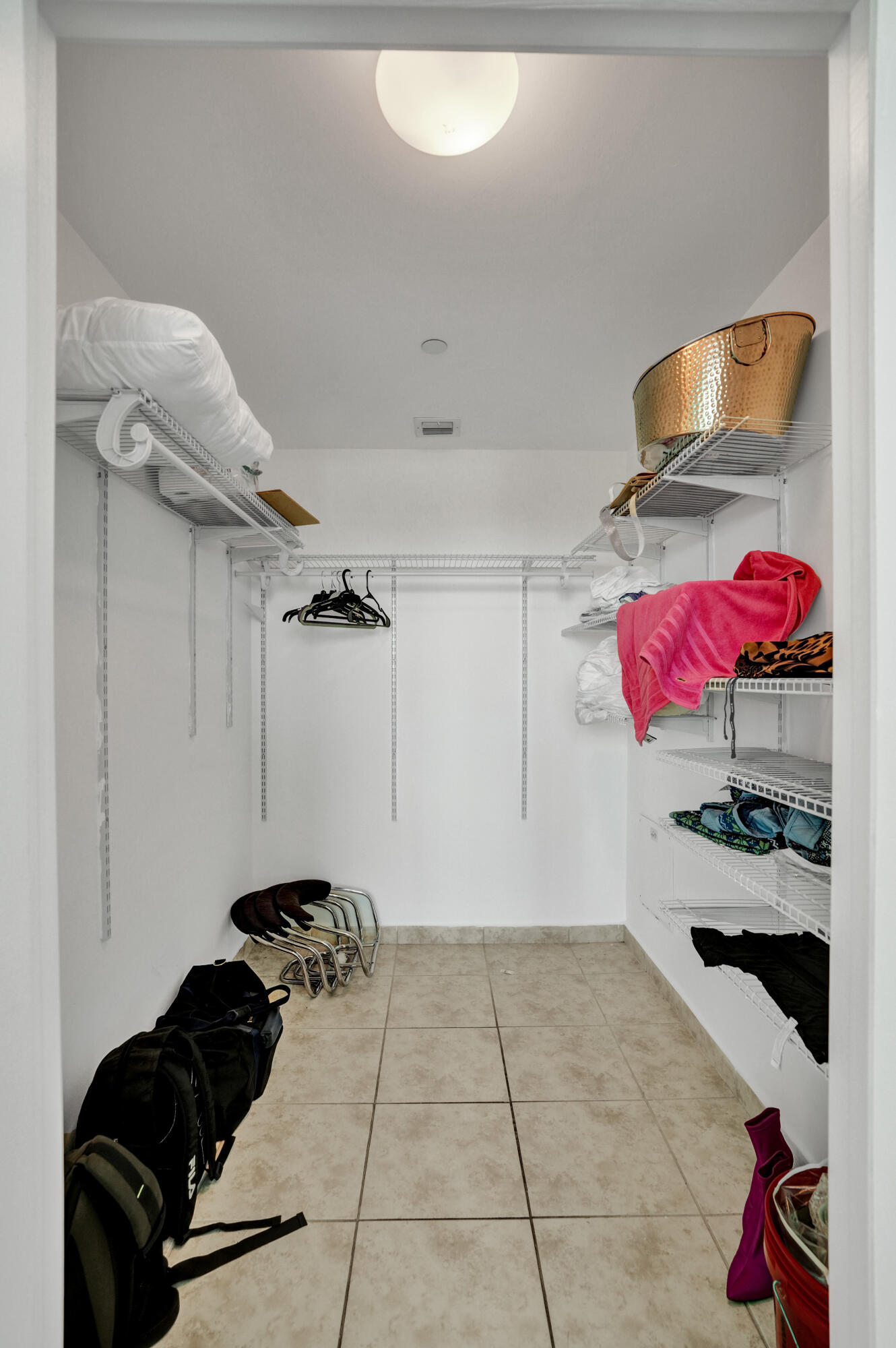 888 Biscayne Boulevard, Unit 811 Miami, FL 33132 - Photo 21 of 48 a room with gym equipment and cabinets