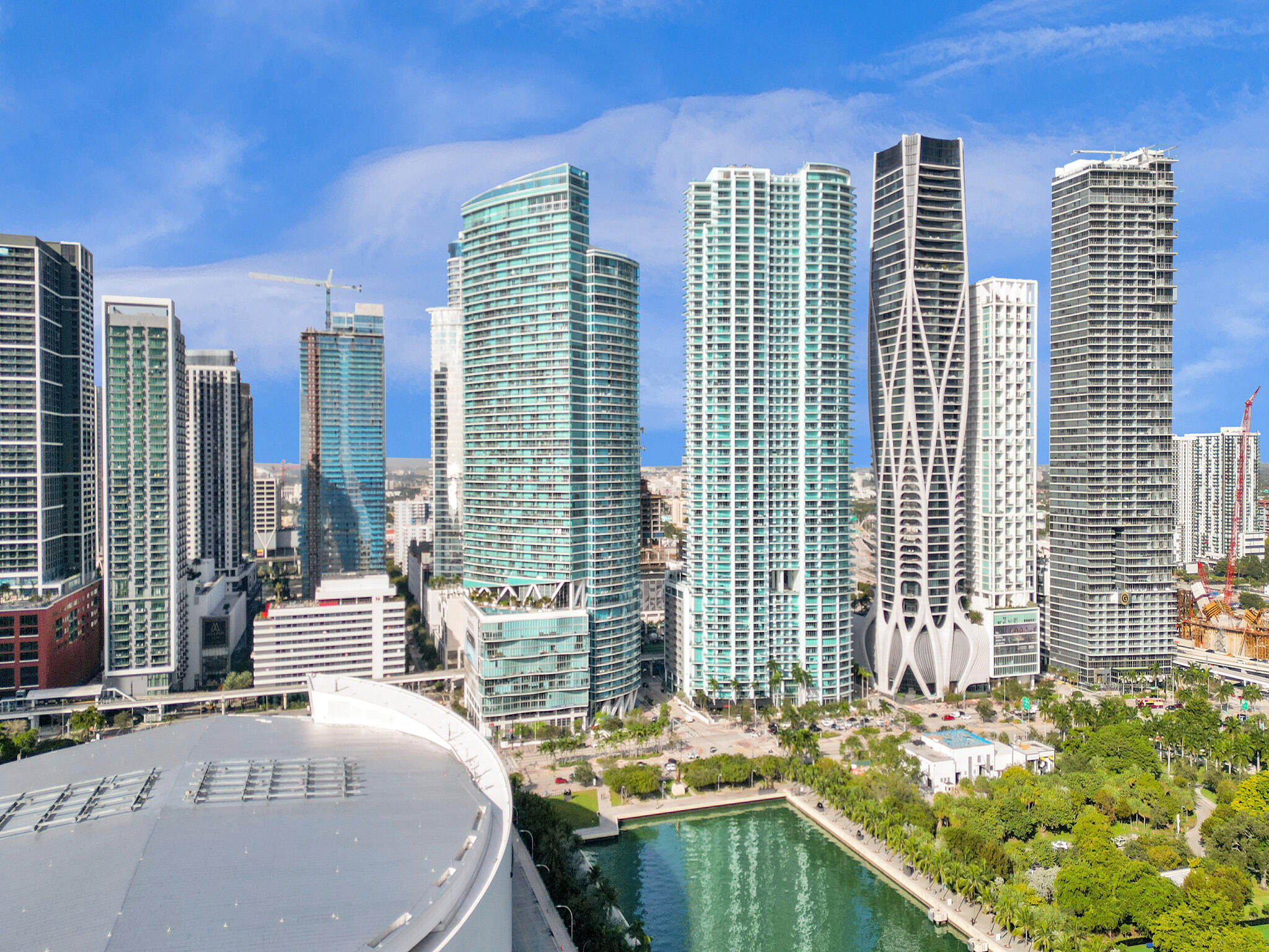 888 Biscayne Boulevard, Unit 811 Miami, FL 33132 - Photo 30 of 48 a dining room with chairs and large windows