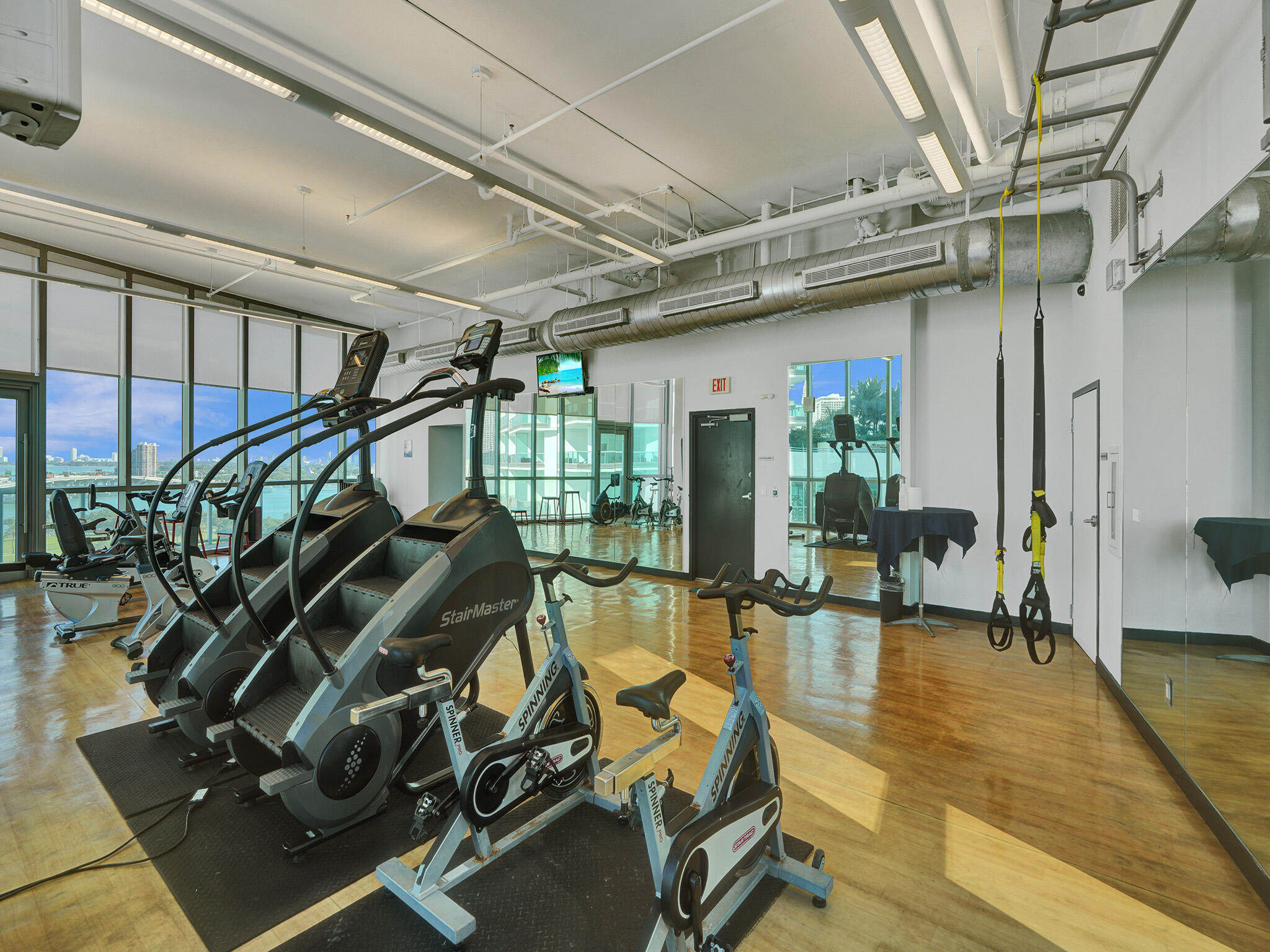 888 Biscayne Boulevard, Unit 811 Miami, FL 33132 - Photo 39 of 48 a view of a room with gym equipment