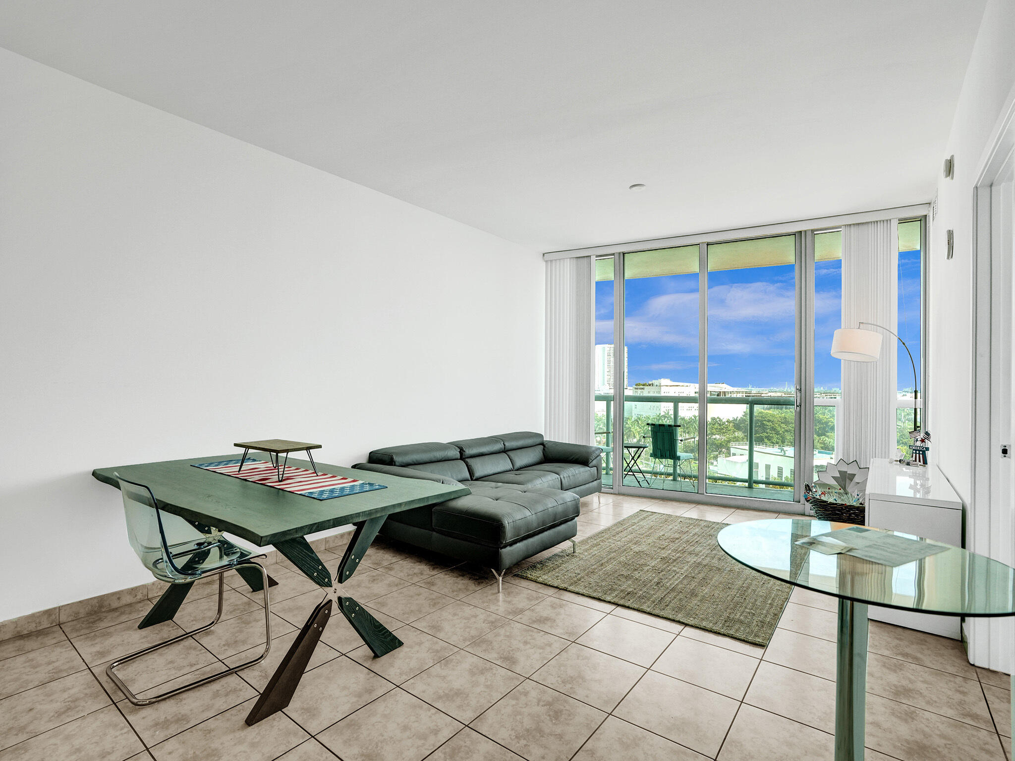 888 Biscayne Boulevard, Unit 811 Miami, FL 33132 - Photo 4 of 48 a living room with furniture and a floor to ceiling window