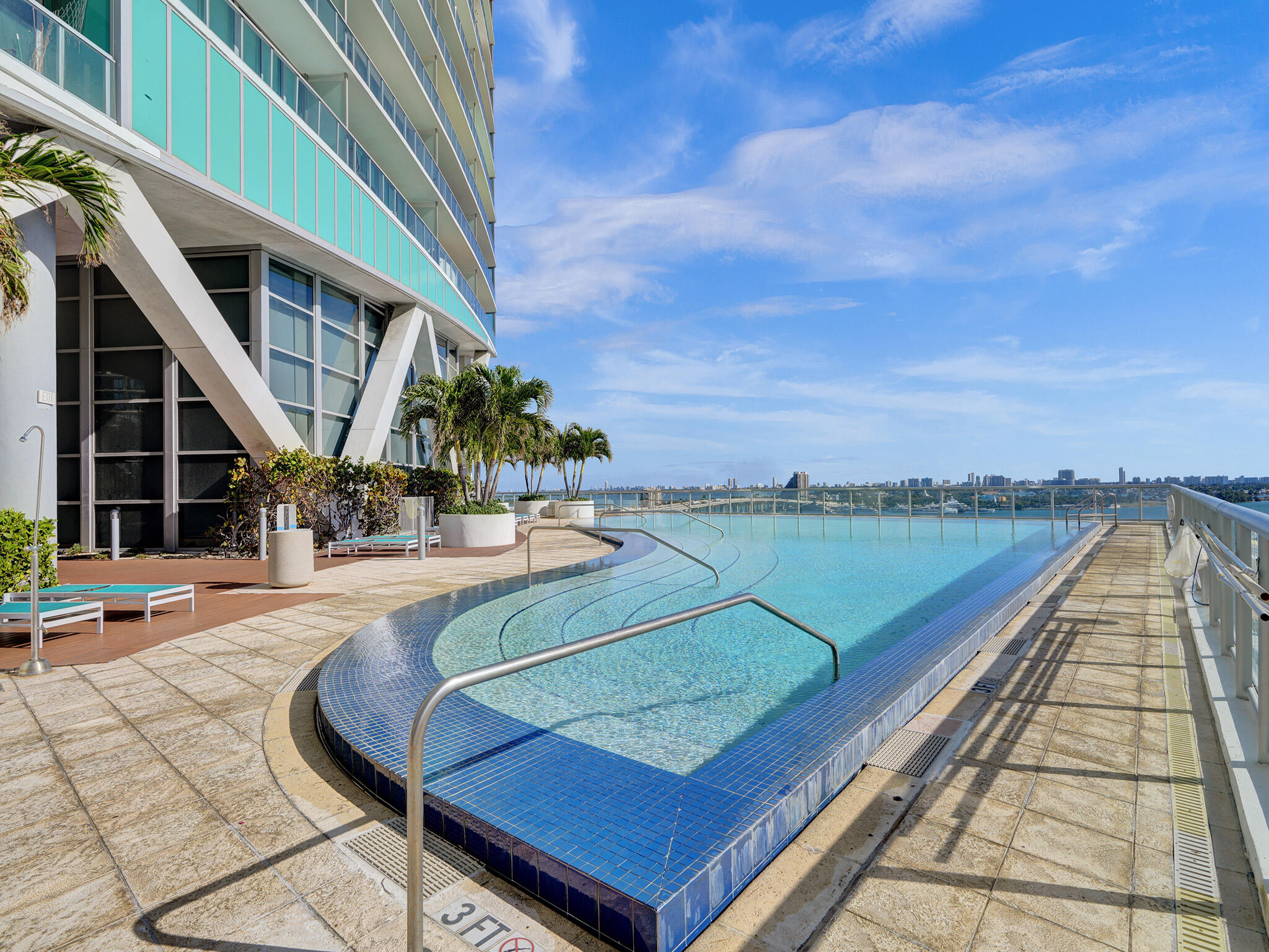 888 Biscayne Boulevard, Unit 811 Miami, FL 33132 - Photo 41 of 48 a view of a swimming pool with seating area and furniture