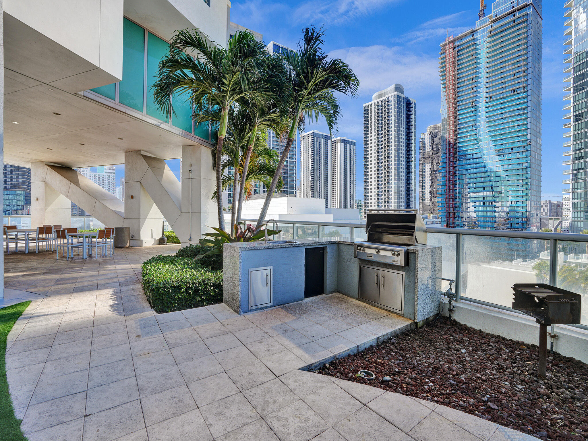 888 Biscayne Boulevard, Unit 811 Miami, FL 33132 - Photo 46 of 48 a kitchen with a sink and a stove