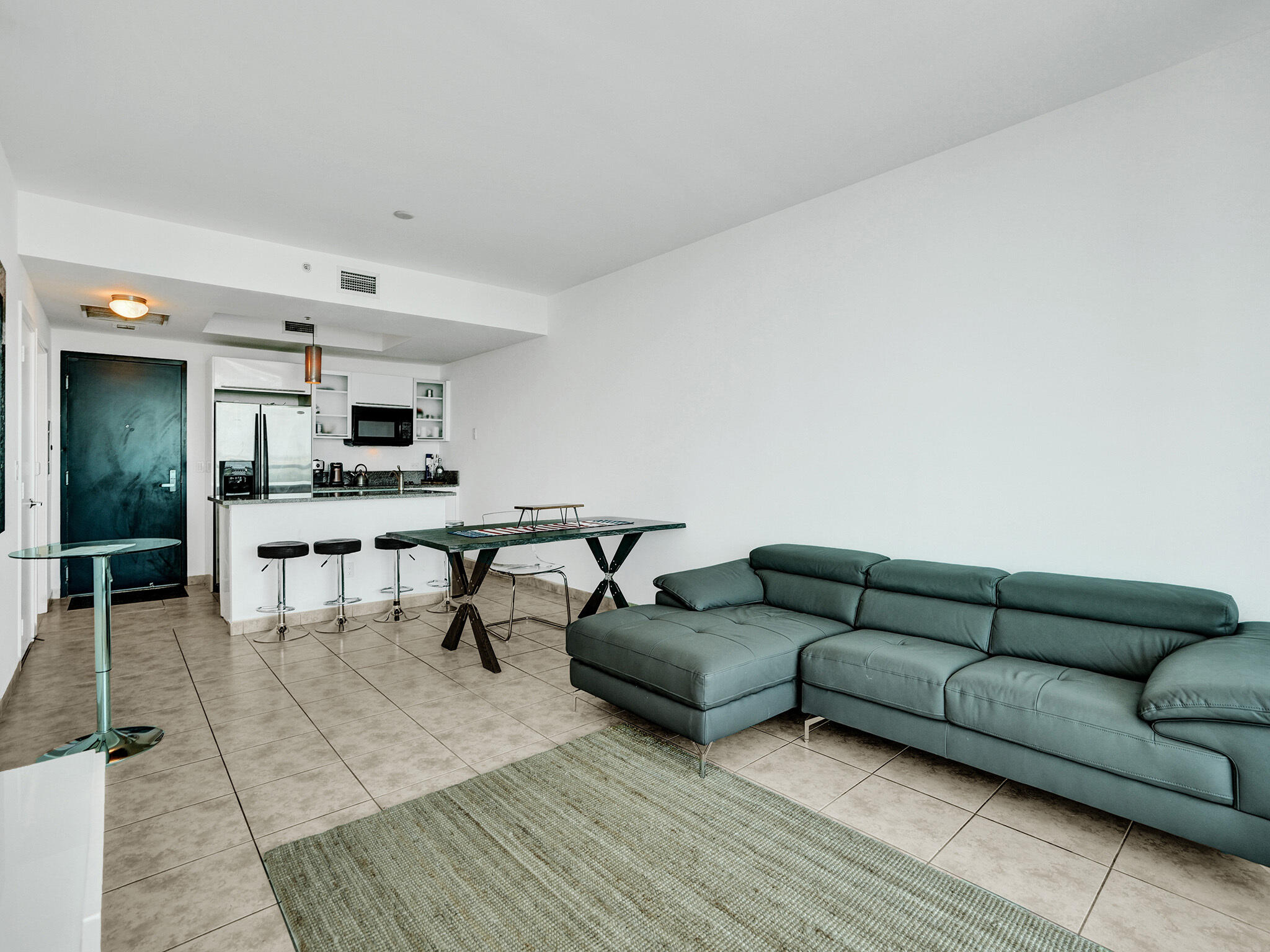 888 Biscayne Boulevard, Unit 811 Miami, FL 33132 - Photo 9 of 48 a living room with furniture and view of kitchen