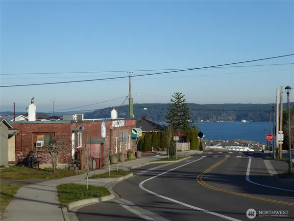 a view of a building with cars parked