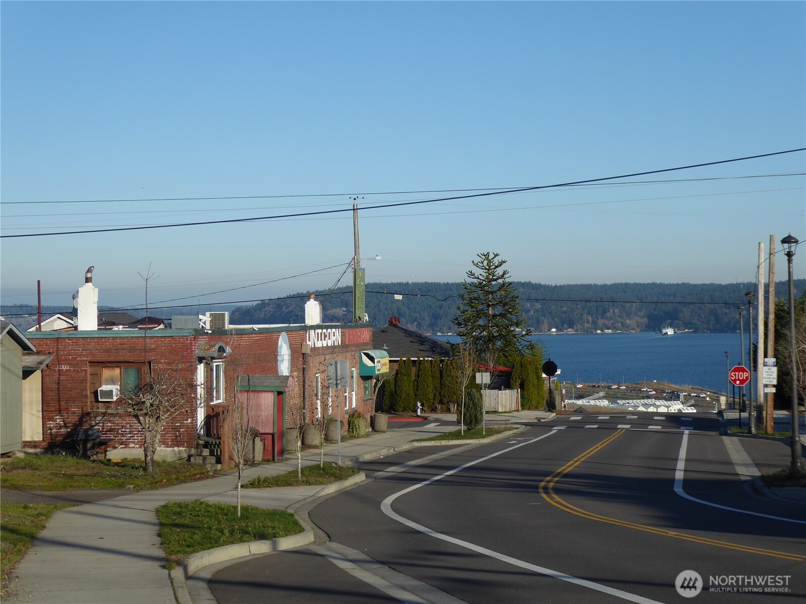 a view of a building with cars parked