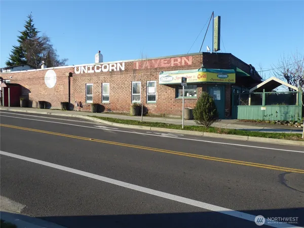 a view of a food mall next to a road