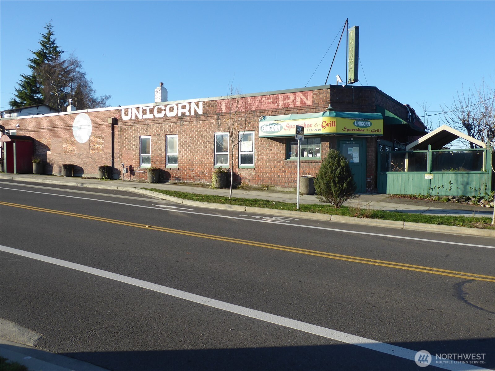 5302 North 49th Street Ruston, WA 98407 - Photo 2 of 16 a view of a food mall next to a road