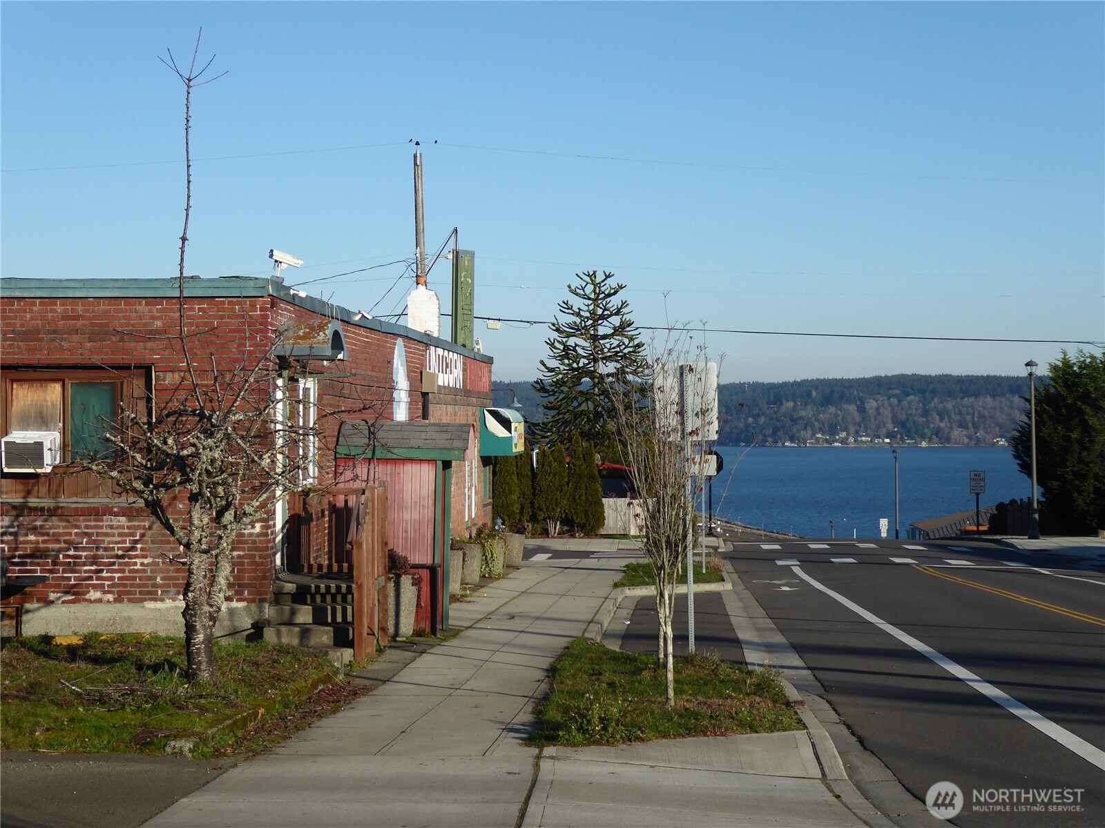 5302 North 49th Street Ruston, WA 98407 - Photo 3 of 16 a front view of a house with a yard