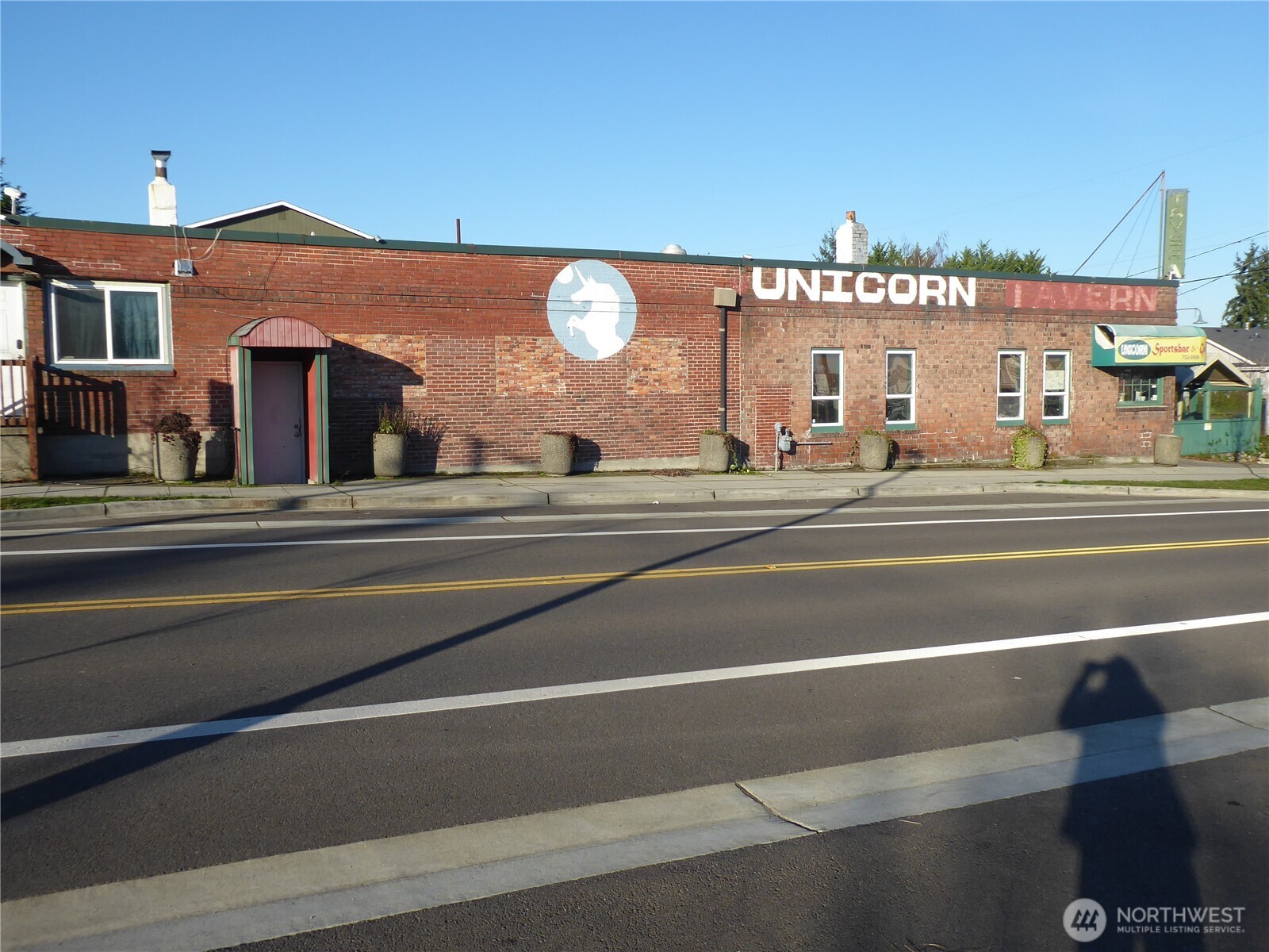 5302 North 49th Street Ruston, WA 98407 - Photo 7 of 16 a view of a building and a ocean view