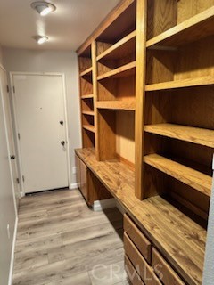 1320 Cadwell Court Riverside, CA 92506 - Photo 12 of 44 a view of walk in closet with clothes and shoes