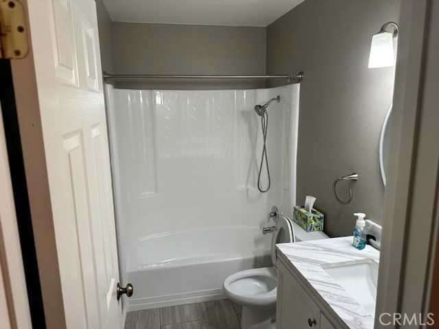 1320 Cadwell Court Riverside, CA 92506 - Photo 13 of 44 a bathroom with a granite countertop sink toilet and shower