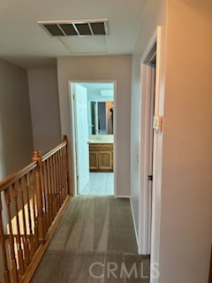 1320 Cadwell Court Riverside, CA 92506 - Photo 15 of 44 a view of a hallway to a livingroom with wooden floor and staircase