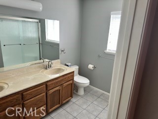 1320 Cadwell Court Riverside, CA 92506 - Photo 16 of 44 a bathroom with a sink and a mirror