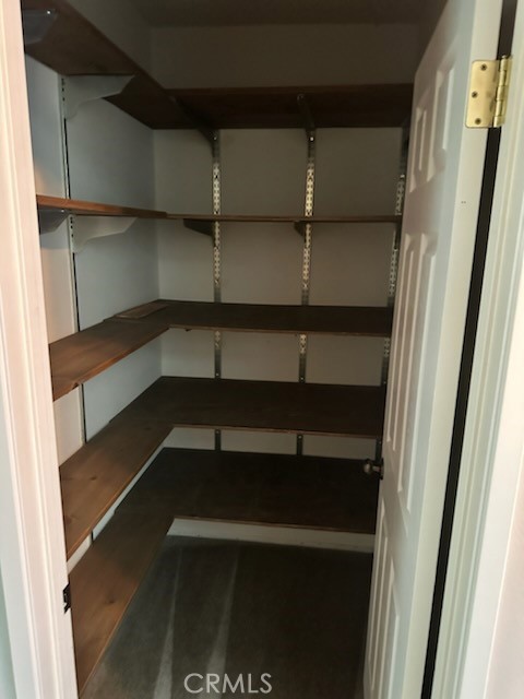 1320 Cadwell Court Riverside, CA 92506 - Photo 18 of 44 a view of walk in closet with empty racks