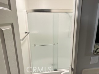 1320 Cadwell Court Riverside, CA 92506 - Photo 23 of 44 a bathroom with a glass shower door
