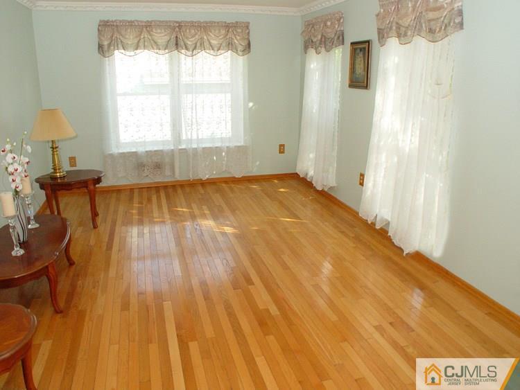 21 Smithwold Road Somerset, NJ 08873 - Photo 2 of 20 a view of a room with wooden floor and furniture