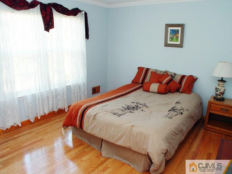 21 Smithwold Road Somerset, NJ 08873 - Photo 13 of 20 a large bed sitting in a bedroom next to a window