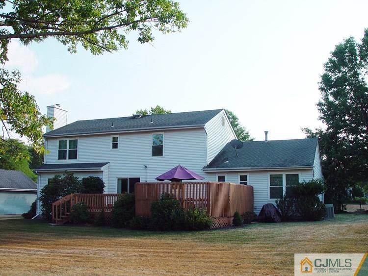 21 Smithwold Road Somerset, NJ 08873 - Photo 17 of 20 a front view of house with yard and trees in the background