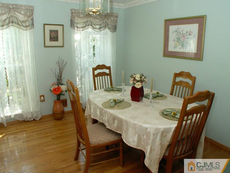 21 Smithwold Road Somerset, NJ 08873 - Photo 3 of 20 a view of a dining room with furniture and wooden floor