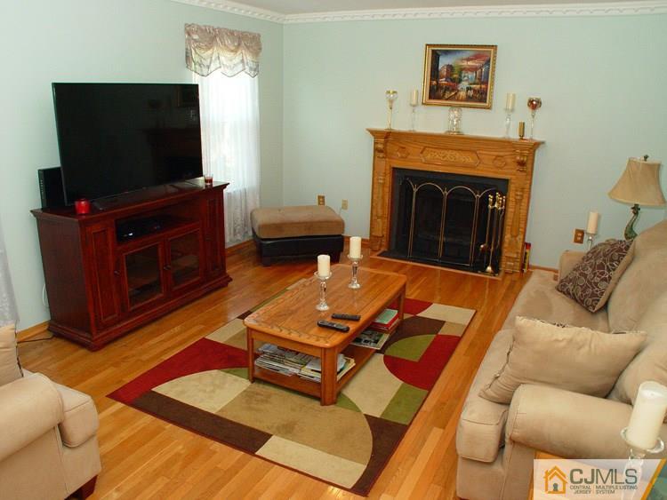 21 Smithwold Road Somerset, NJ 08873 - Photo 4 of 20 a living room with furniture and a flat screen tv