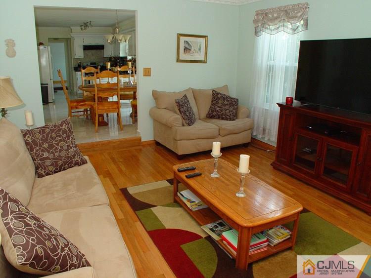 21 Smithwold Road Somerset, NJ 08873 - Photo 5 of 20 a living room with furniture and a flat screen tv