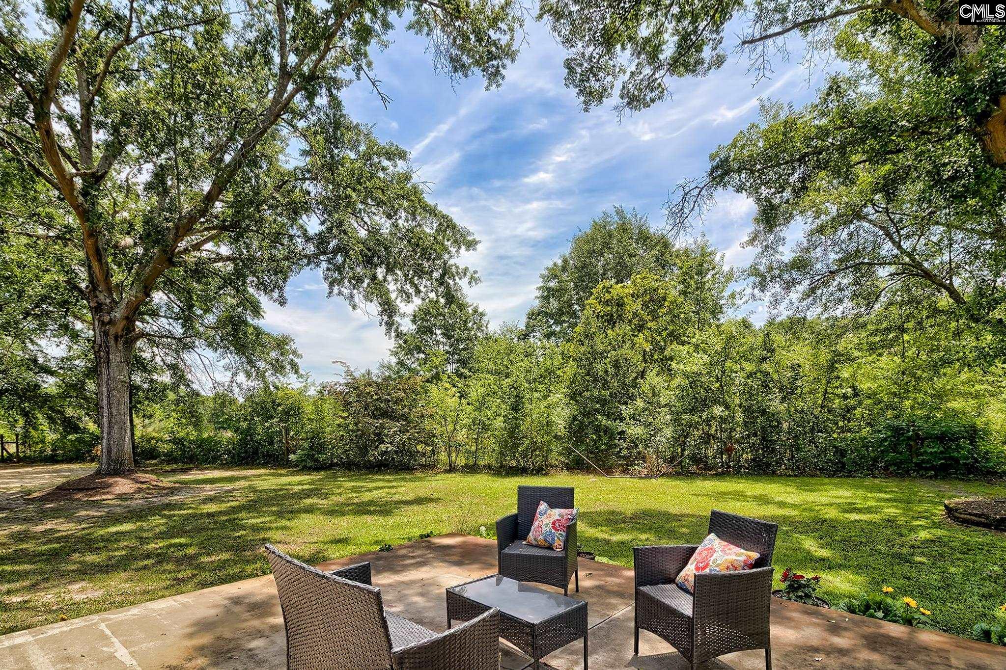 1415 State Rd S-28-55 Lugoff, SC 29078 - Photo 39 of 39 a view of a swimming pool and lounge chairs in the patio