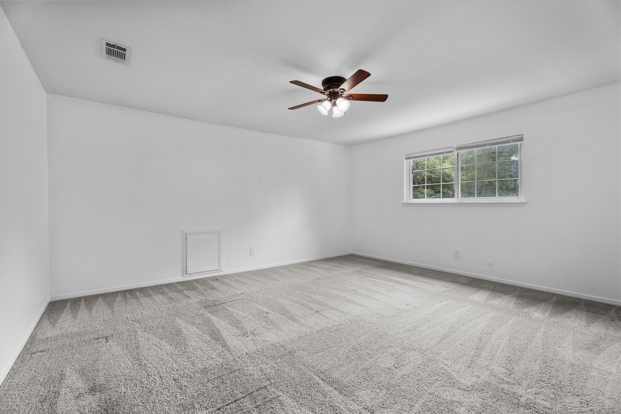 17319 Cypress Spring Drive Spring, TX 77388 - Photo 25 of 50 We move upstairs to the Primary Bedroom with soft carpet, lighted ceiling fan, and plenty of room for a king sized bed.