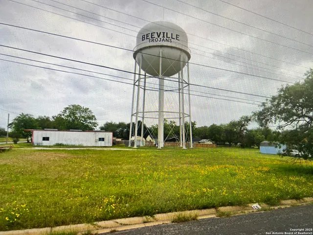 a view of a swimming pool with a yard