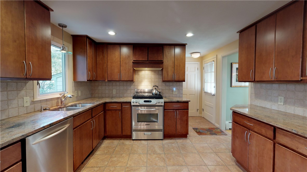 70 Timberline Road Warwick, RI 02886 - Photo 6 of 32 Kitchen updates include solid wood cabinetry with pull out shelving, beautiful granite countertops, undercabinet lighting, matching stainless steel appliances.