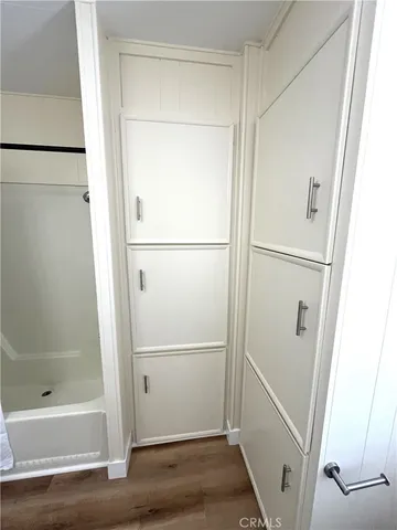 a bathroom with a glass shower door