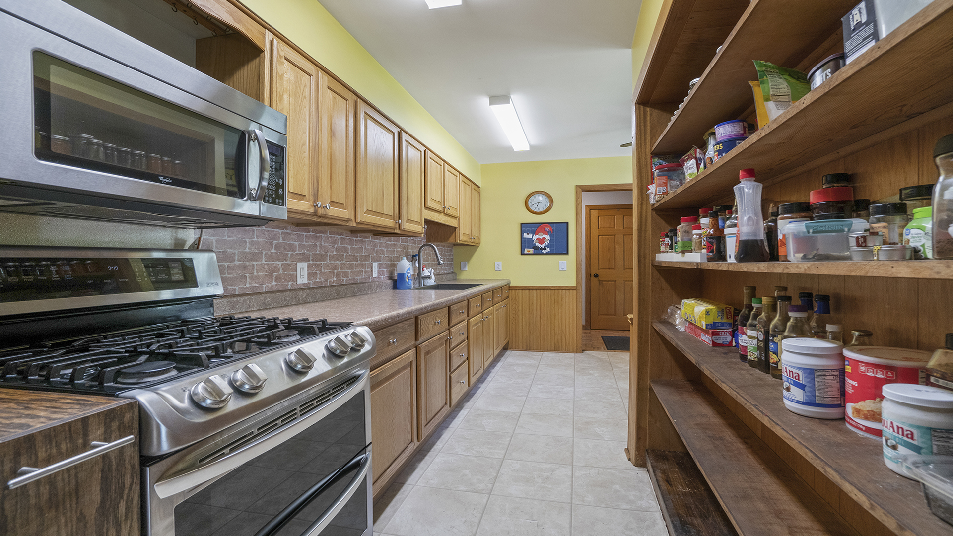 2077 Grand Detour Road Dixon, IL 61021 - Photo 17 of 33 a kitchen with stainless steel appliances granite countertop a stove and cabinets