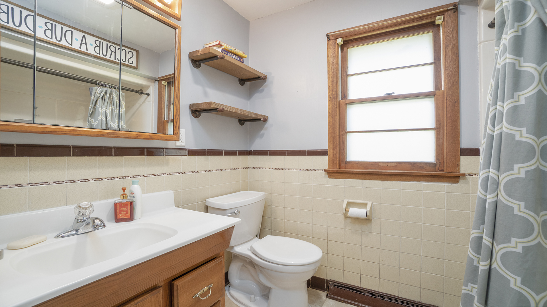 2077 Grand Detour Road Dixon, IL 61021 - Photo 23 of 33 a bathroom with a sink a toilet and a window