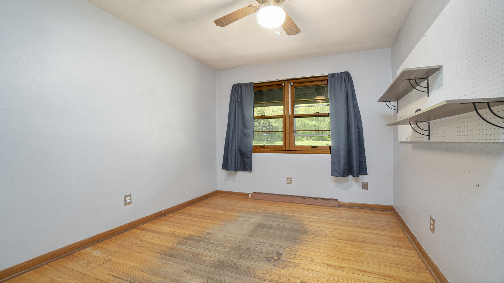 2077 Grand Detour Road Dixon, IL 61021 - Photo 24 of 33 a view of an empty room with wooden floor and a window