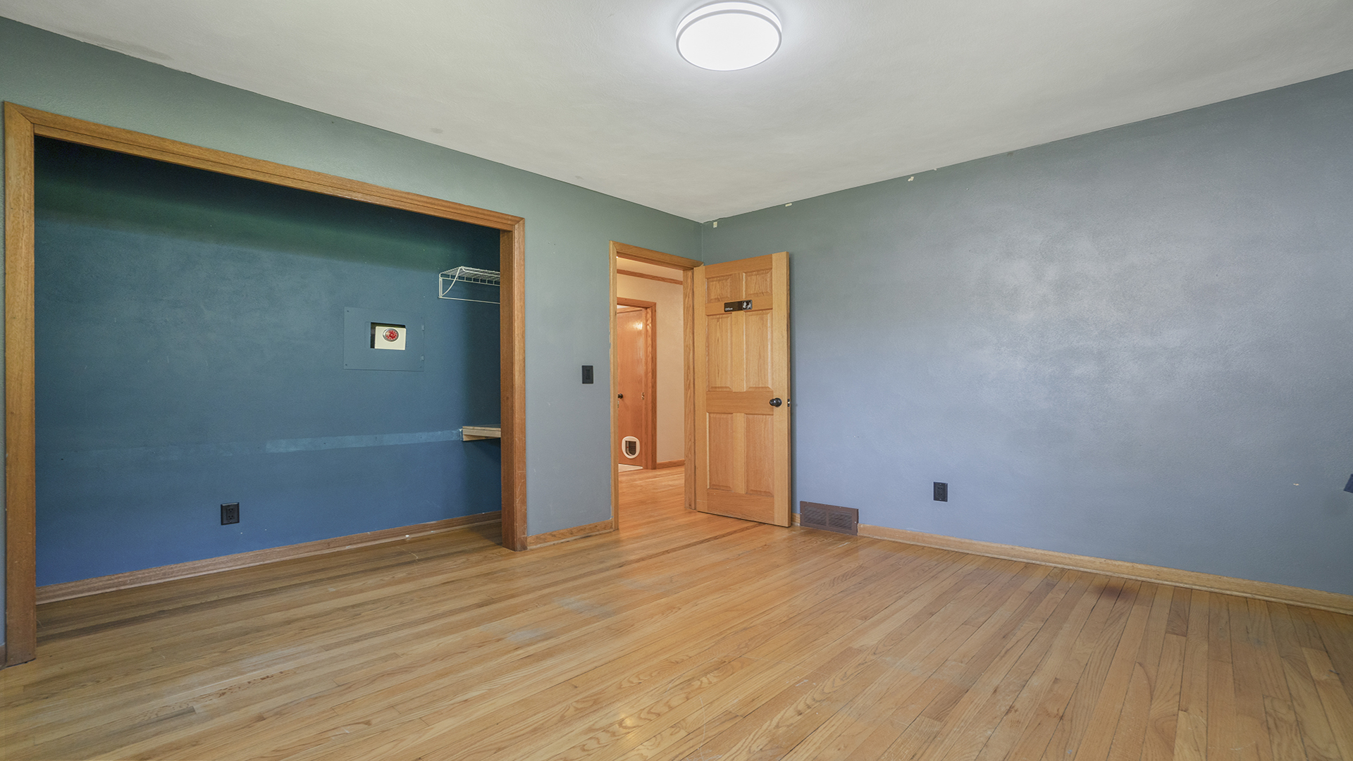 2077 Grand Detour Road Dixon, IL 61021 - Photo 27 of 33 an empty room with wooden floor and closet