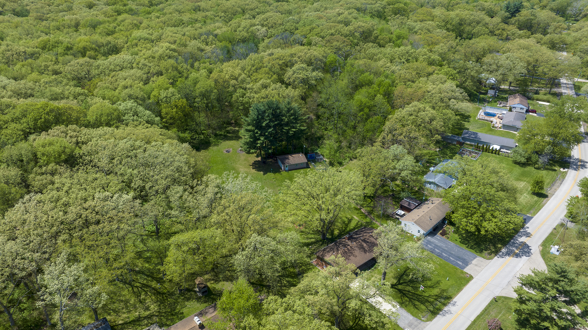 2077 Grand Detour Road Dixon, IL 61021 - Photo 5 of 33 an aerial view of residential house with outdoor space and trees all around
