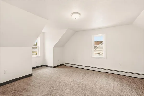 an empty room with a empty space and window