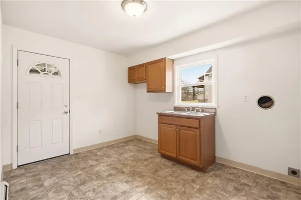 a bathroom with a sink and vanity
