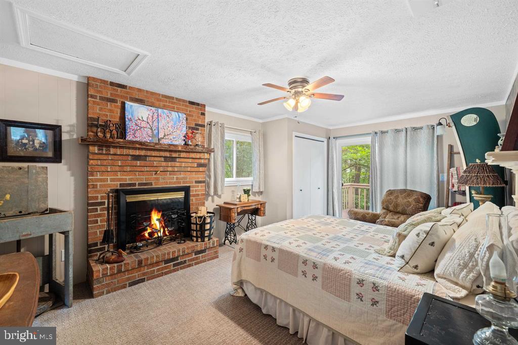112 Judd Lane Mount Jackson, VA 22842 - Photo 29 of 63 a bedroom with a bed and a fireplace