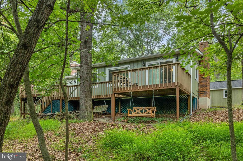 112 Judd Lane Mount Jackson, VA 22842 - Photo 48 of 63 a house with tall trees in front of it