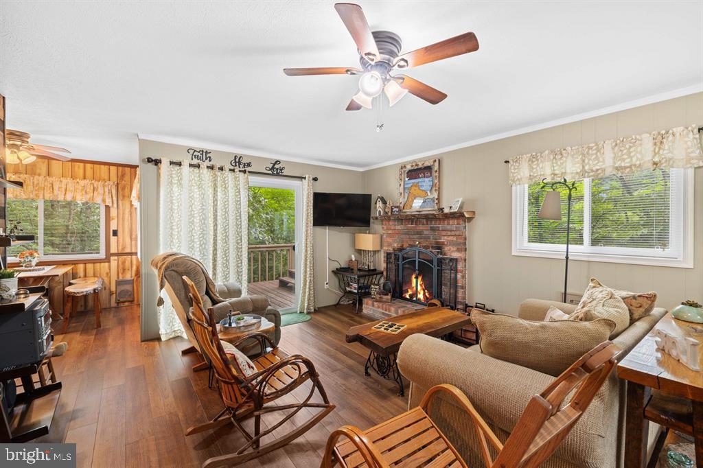 112 Judd Lane Mount Jackson, VA 22842 - Photo 10 of 63 a living room with furniture fireplace and a large window