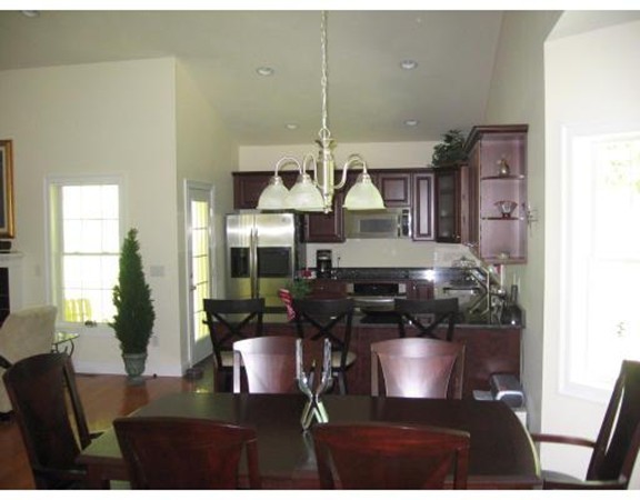 749 Lowell Road, Unit B Groton, MA 01450 - Photo 7 of 16 a view of a dining room with furniture