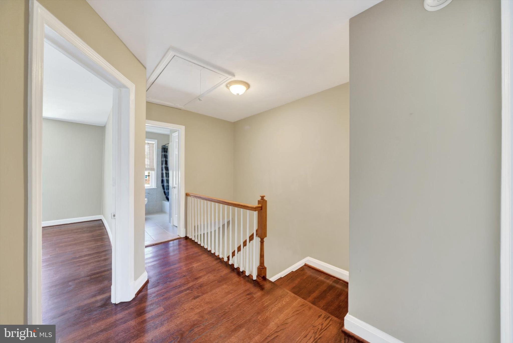 316 Lambeth Road Baltimore, MD 21228 - Photo 12 of 28 a view of a hallway with wooden floor
