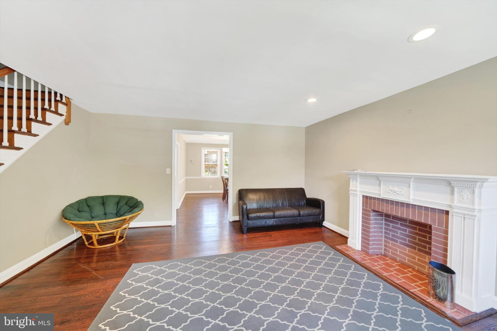 316 Lambeth Road Baltimore, MD 21228 - Photo 5 of 28 a living room with furniture and a fireplace
