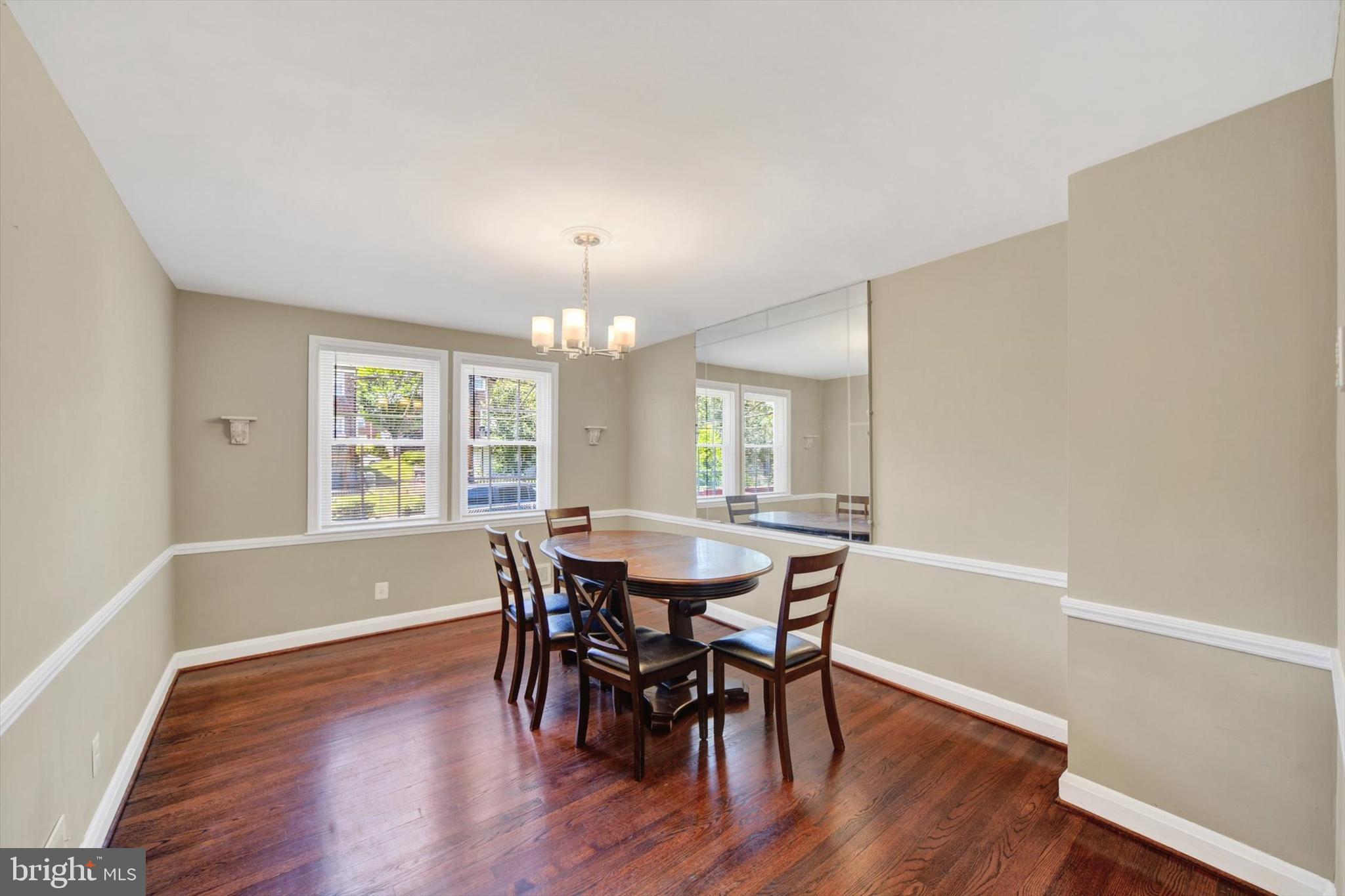 316 Lambeth Road Baltimore, MD 21228 - Photo 9 of 28 a view of a dining room with furniture window and wooden floor