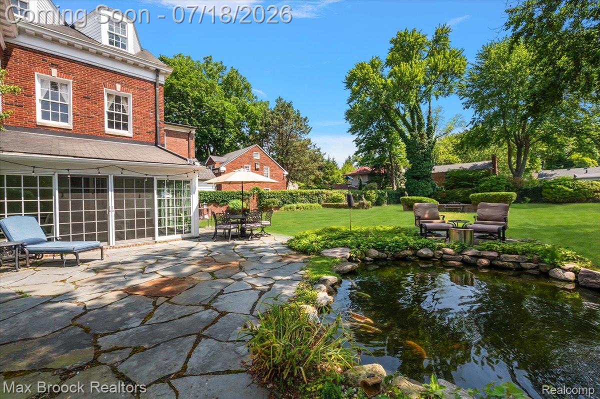 294 Lincoln Road Grosse Pointe, MI 48230 - Photo 63 of 84 Side elevation with view of patio, pond and backyard