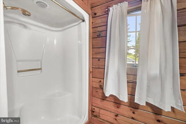 a view of an empty room with windows