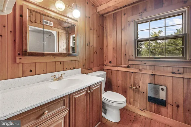 a view of an empty room and a window