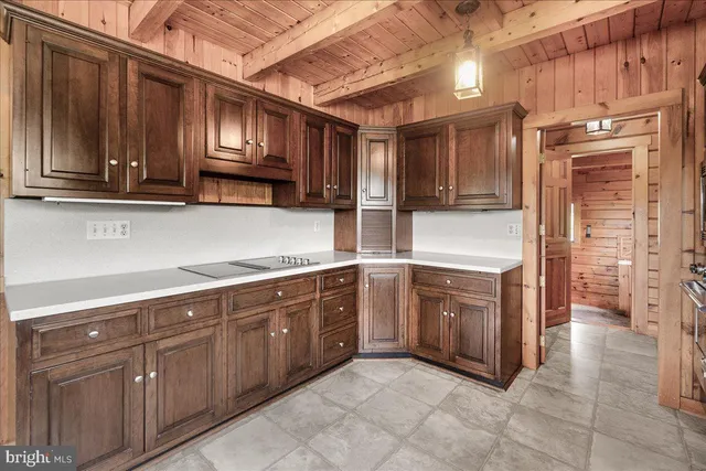 a kitchen with stainless steel appliances granite countertop a sink and cabinets